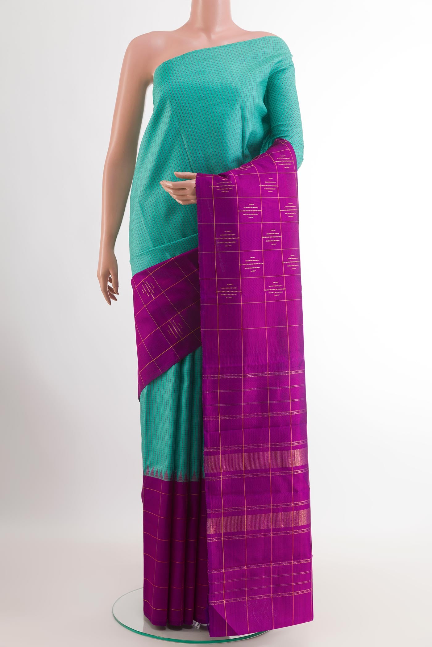 Sea Green Kanchipuram Silk Saree with Checked design on the body and Zari Border.  displayed on a mannequin