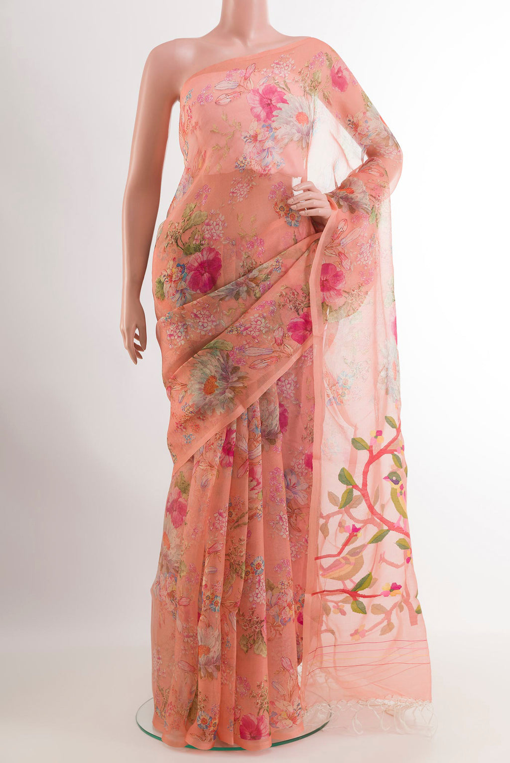 Pink Organza Silk Saree with Printed design on the body and Zari Border.  displayed on a mannequin