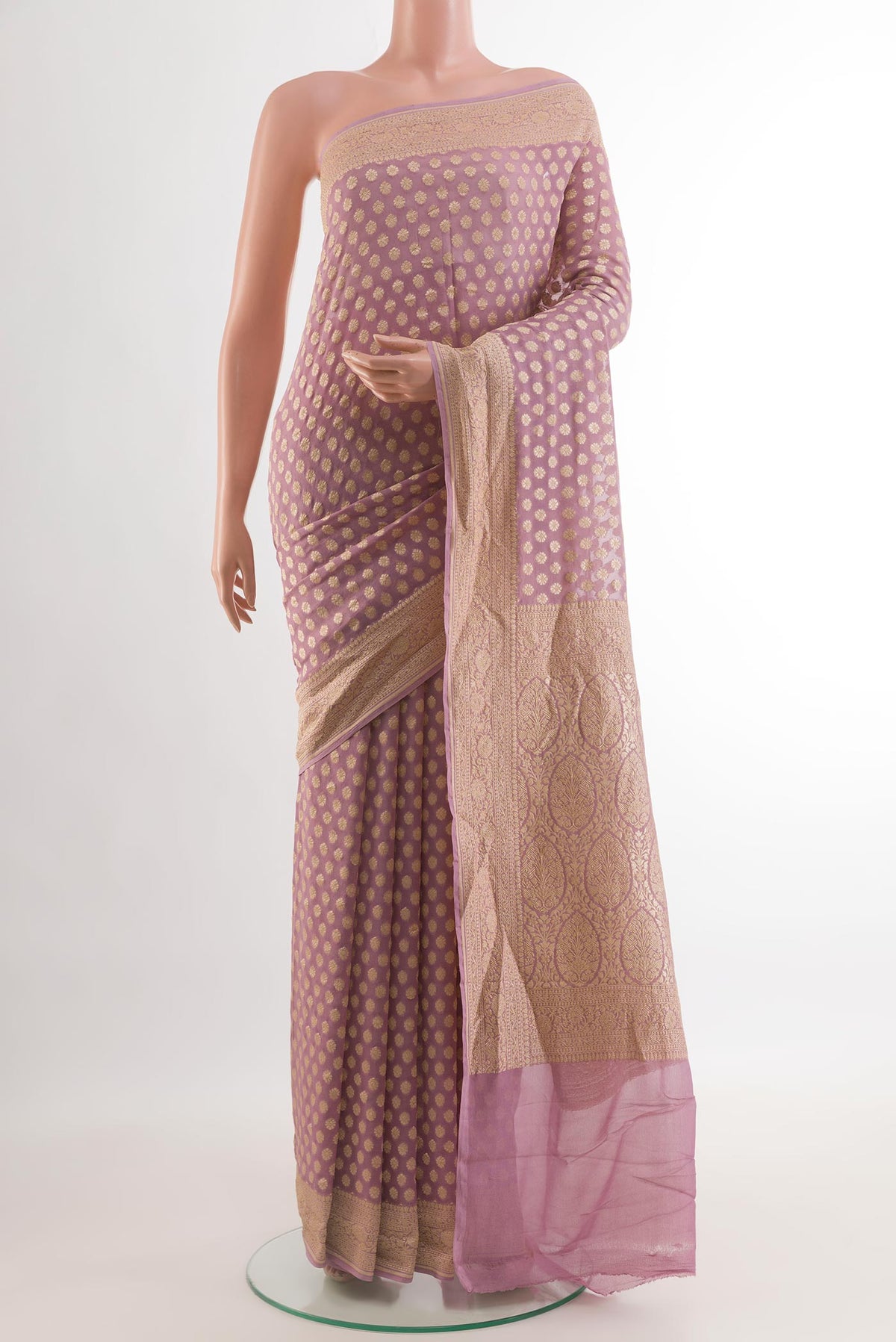 Lavender Banarasi Georgette Saree with Zari Butta on the body and Zari Border.  displayed on a mannequin