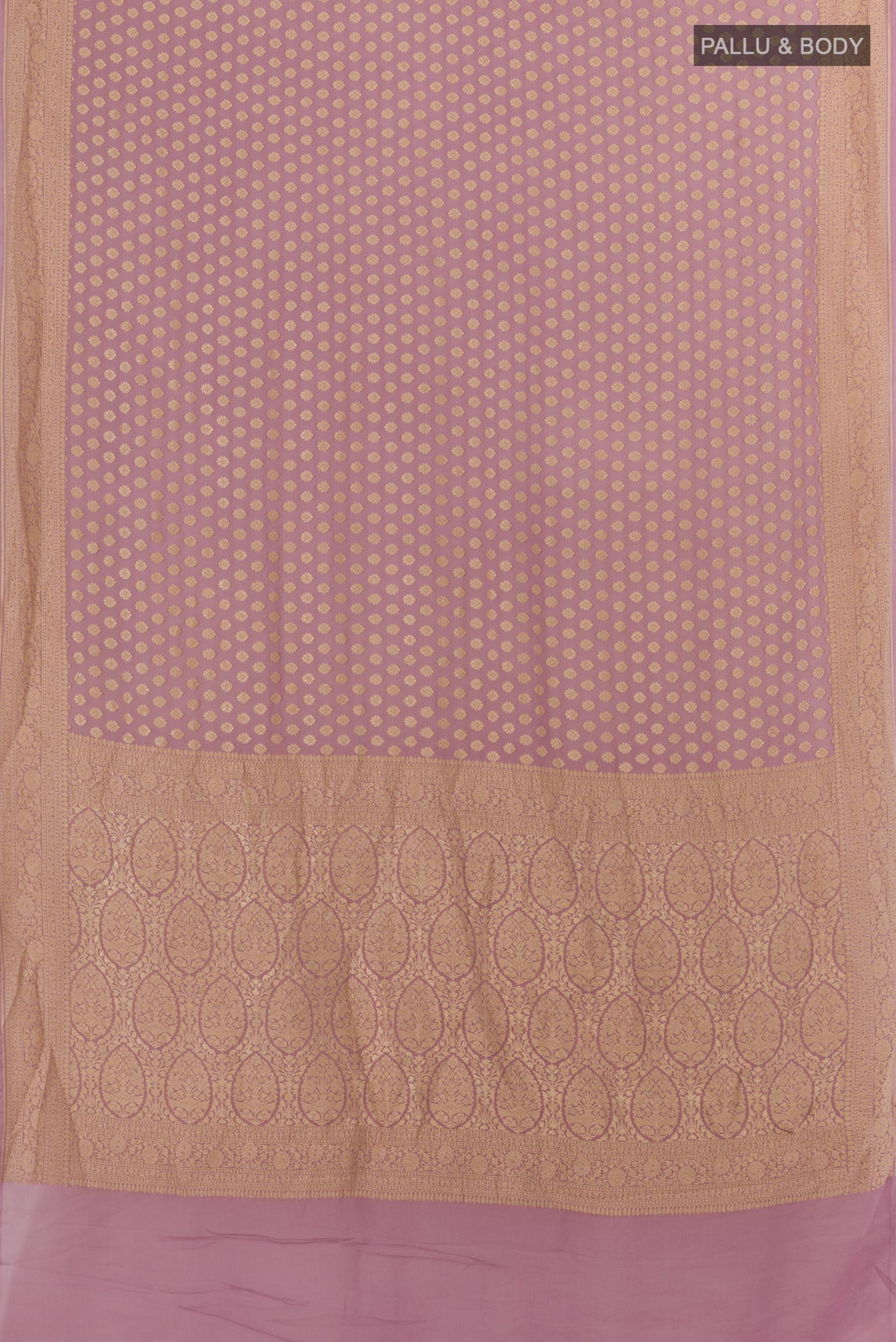 Flat view of Lavender Banarasi Georgette Saree with Zari Butta on the body and Zari Border. 
