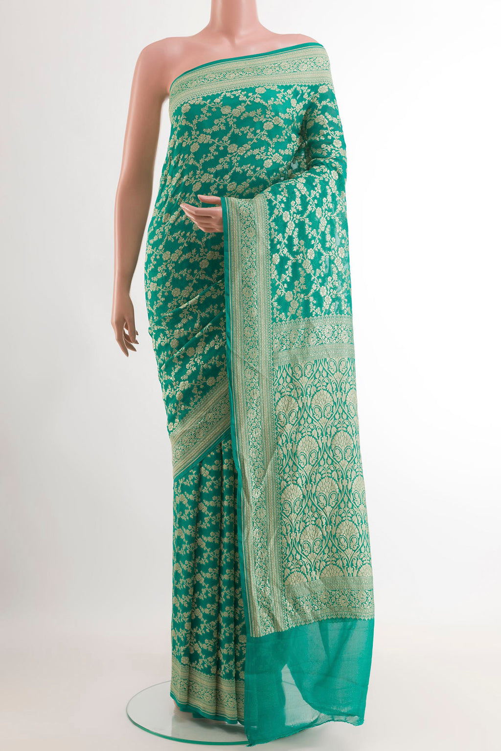 Sea Green Banarasi Georgette Saree with Zari Brocade on the body and Zari Border.  displayed on a mannequin