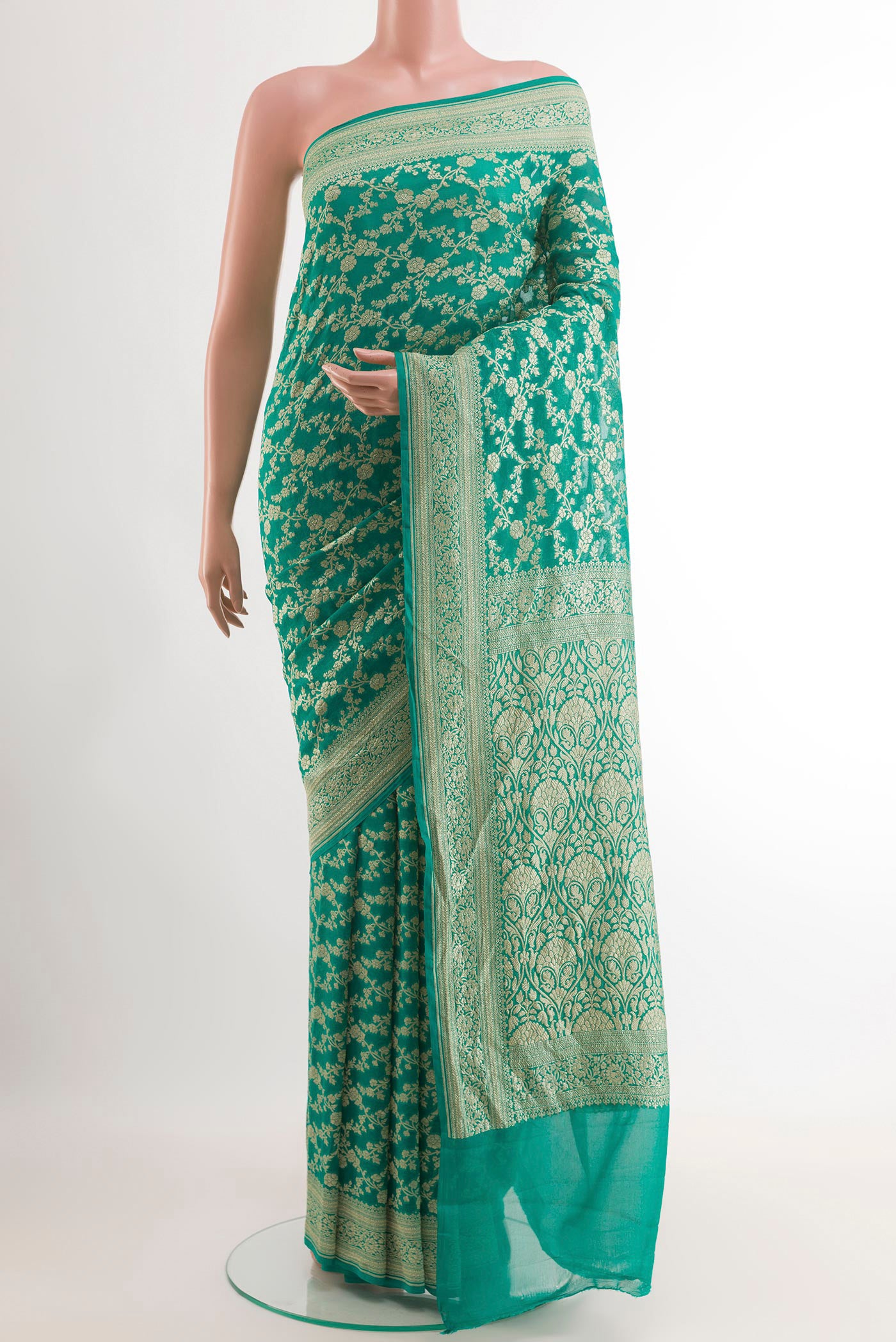 Sea Green Banarasi Georgette Saree with Zari Brocade on the body and Zari Border.  displayed on a mannequin