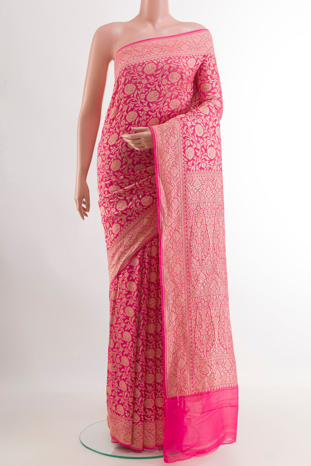 Pink Banarasi Georgette Saree with Zari Brocade on the body and Zari Border.  displayed on a mannequin