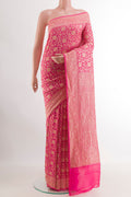 Pink Banarasi Georgette Saree with Zari Brocade on the body and Zari Border.  displayed on a mannequin