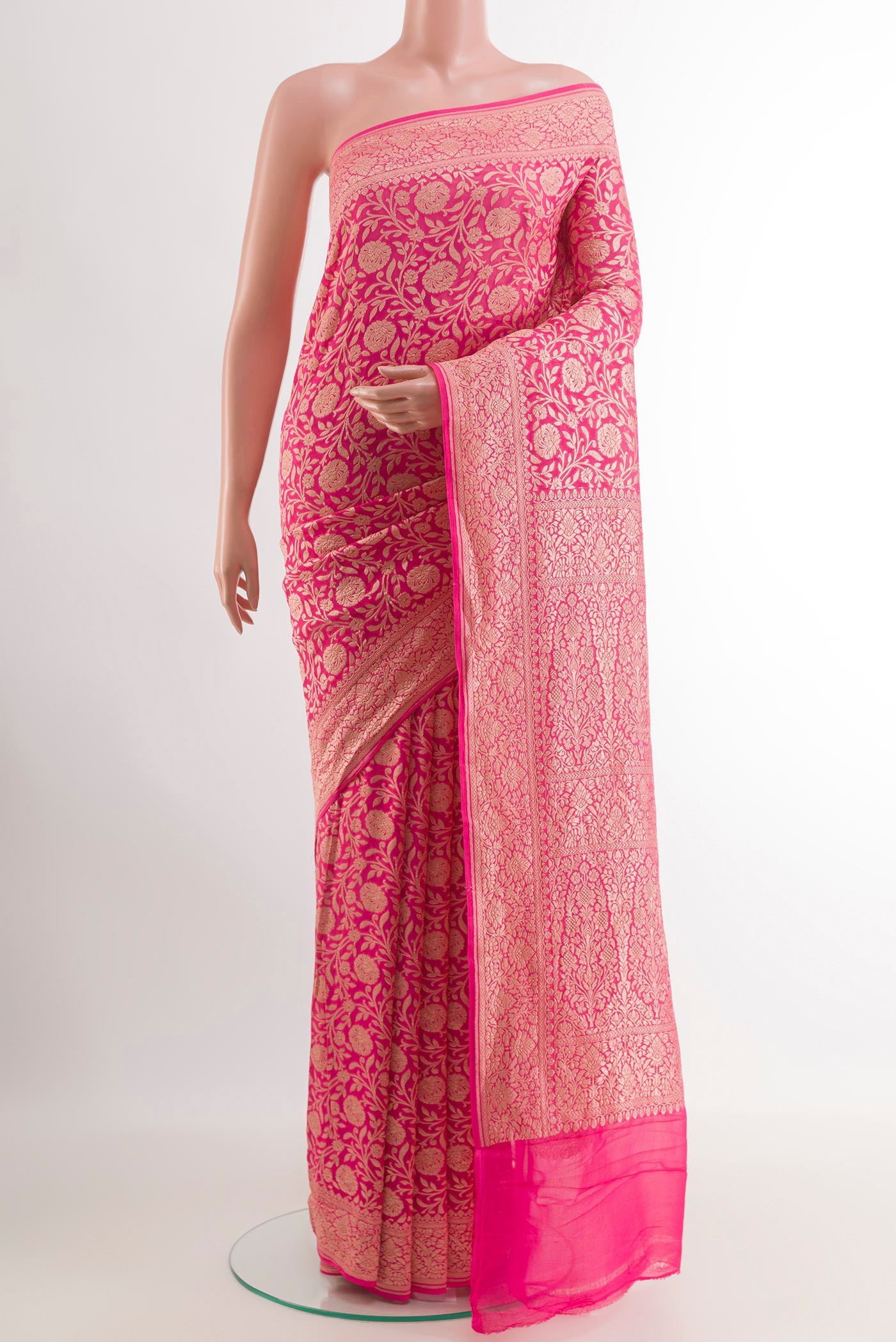 Pink Banarasi Georgette Saree with Zari Brocade on the body and Zari Border.  displayed on a mannequin