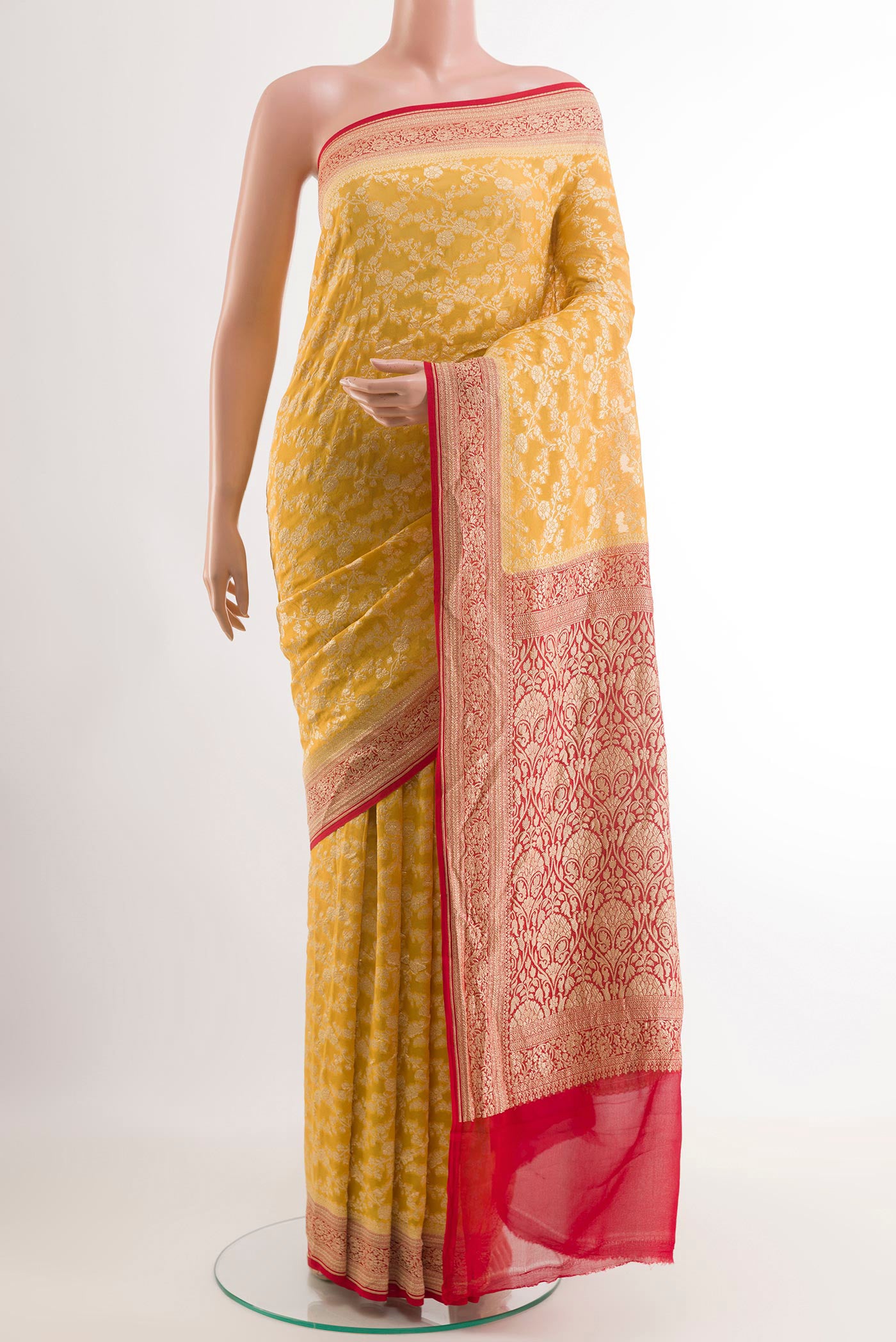 Yellow Banarasi Georgette Saree with Zari Brocade on the body and Paithani Border.  displayed on a mannequin