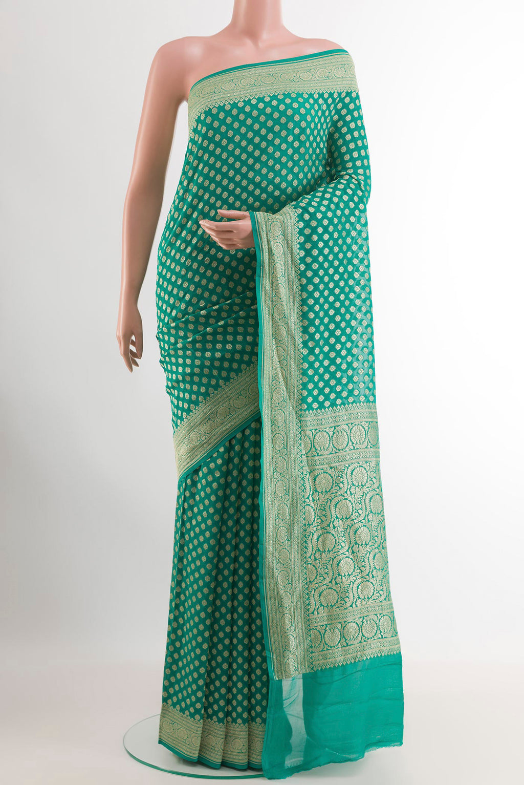 Sea Green Banarasi Georgette Saree with Zari Butta on the body and Zari Border.  displayed on a mannequin