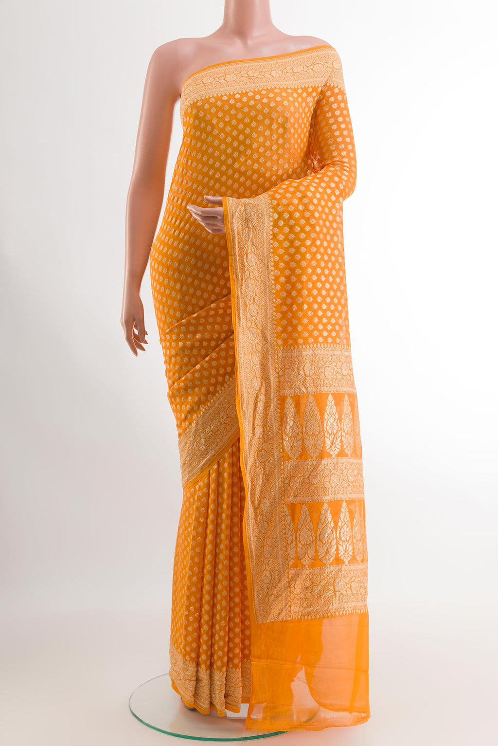 Yellow Banarasi Georgette Saree with Zari Butta on the body and Zari Border.  displayed on a mannequin