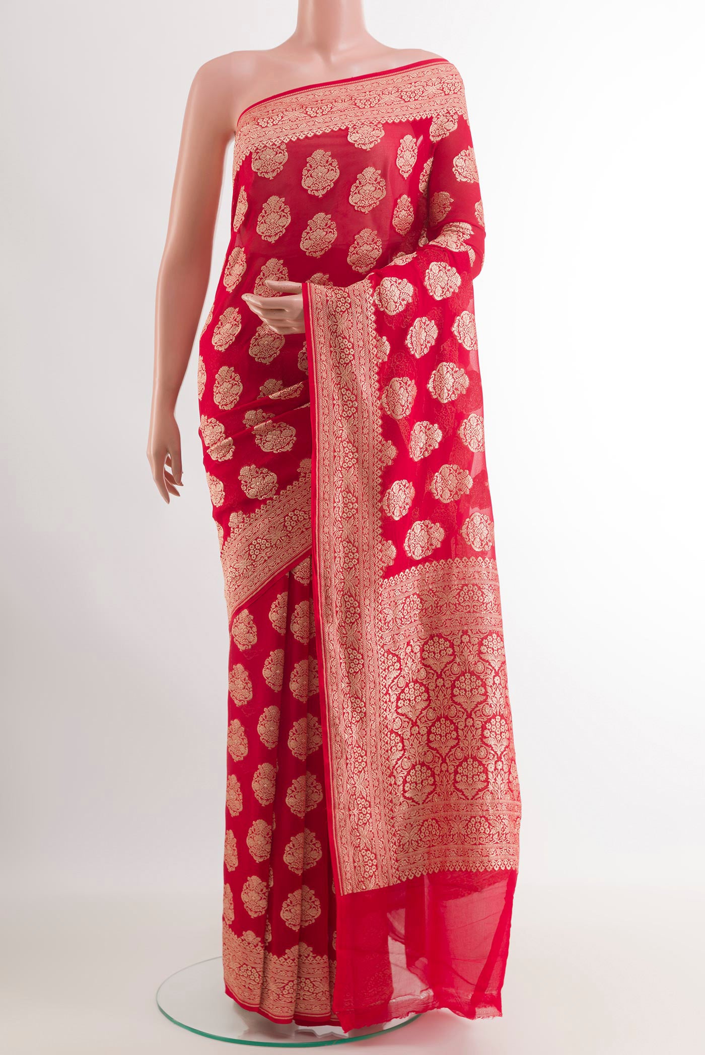 Red Banarasi Georgette Saree with Zari Butta on the body and Zari Border.  displayed on a mannequin