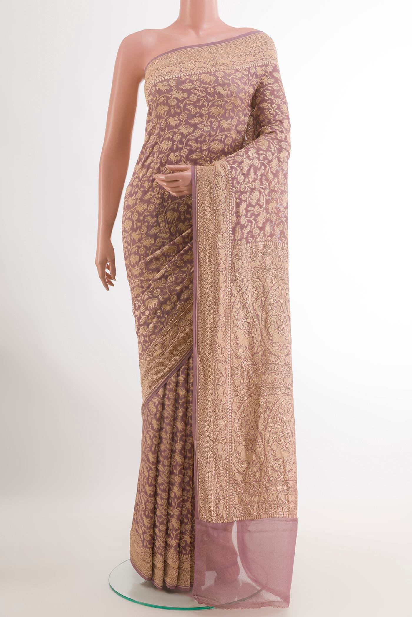 Lavender Banarasi Georgette Saree with Zari Brocade on the body and Zari Border.  displayed on a mannequin
