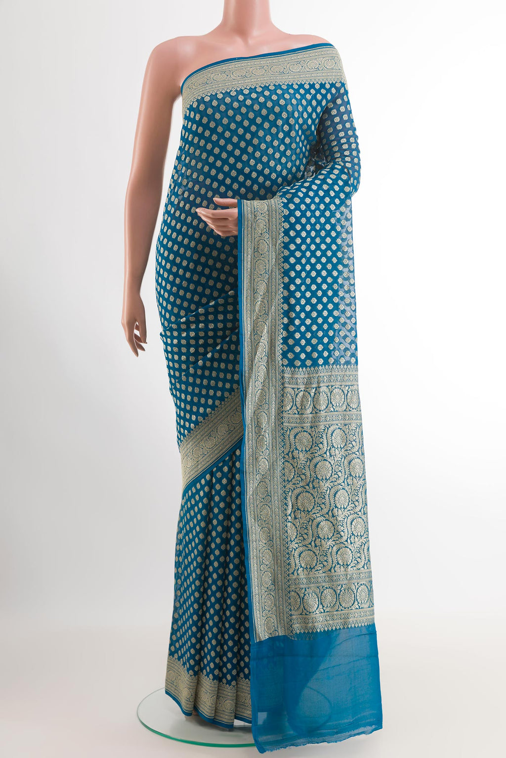 Blue Banarasi Georgette Saree with Zari Butta on the body and Zari Border.  displayed on a mannequin