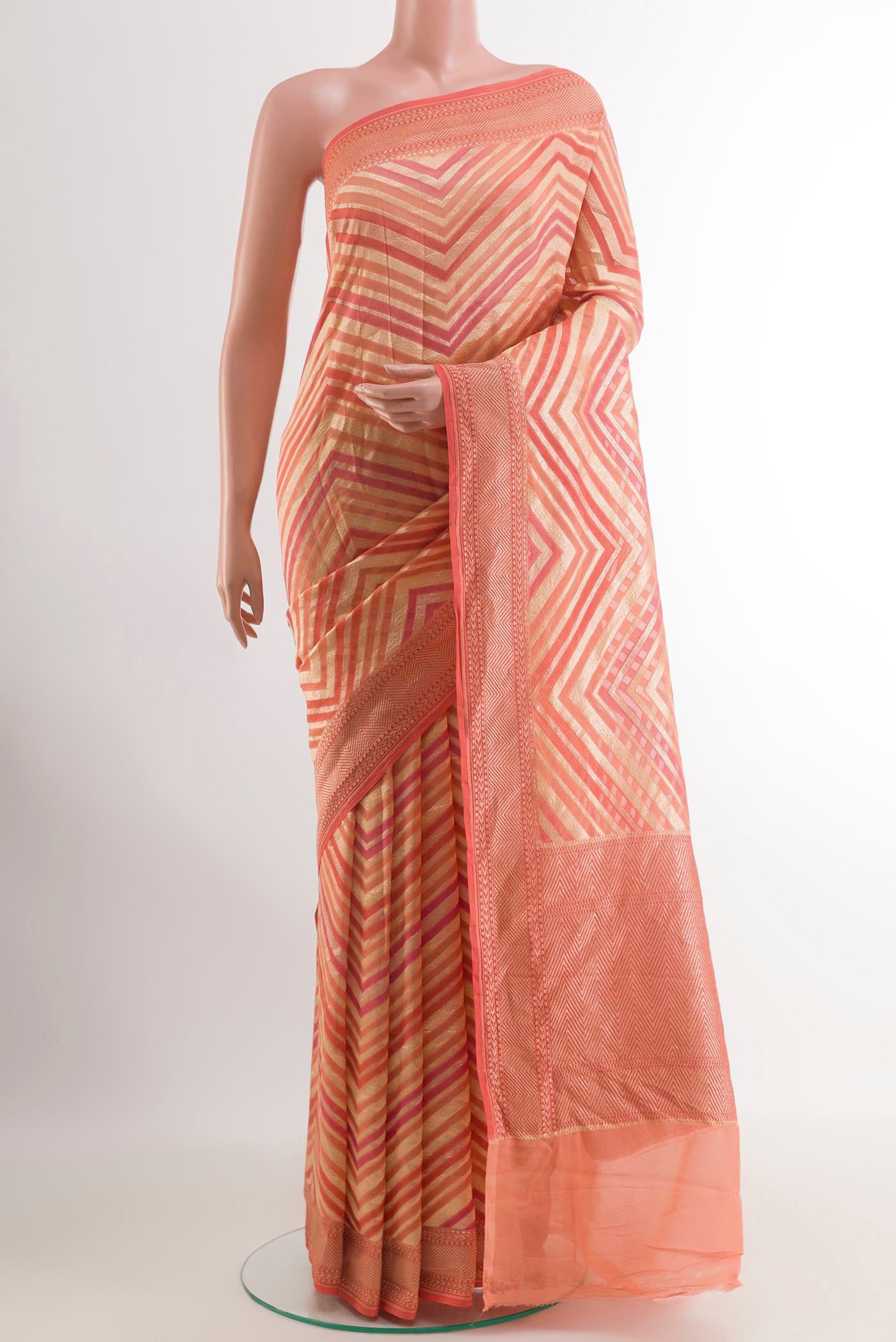 Rose pink Banarasi Georgette Saree with Stripes on the body and Zari Border.  displayed on a mannequin