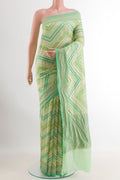 Green Banarasi Georgette Saree with Stripes on the body and Zari Border.  displayed on a mannequin