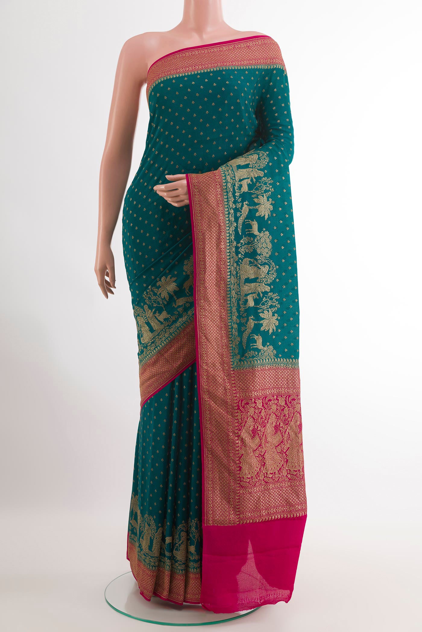 Peacock Blue Banarasi Georgette Saree with Zari Butta on the body and Zari Border.  displayed on a mannequin