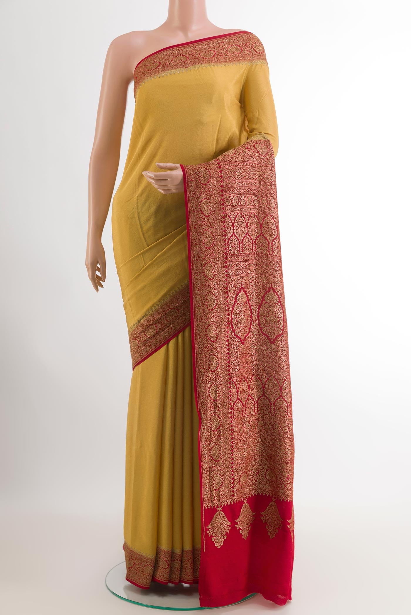 Mustard Banarasi Georgette Saree with Plain Body and Zari Border.  displayed on a mannequin