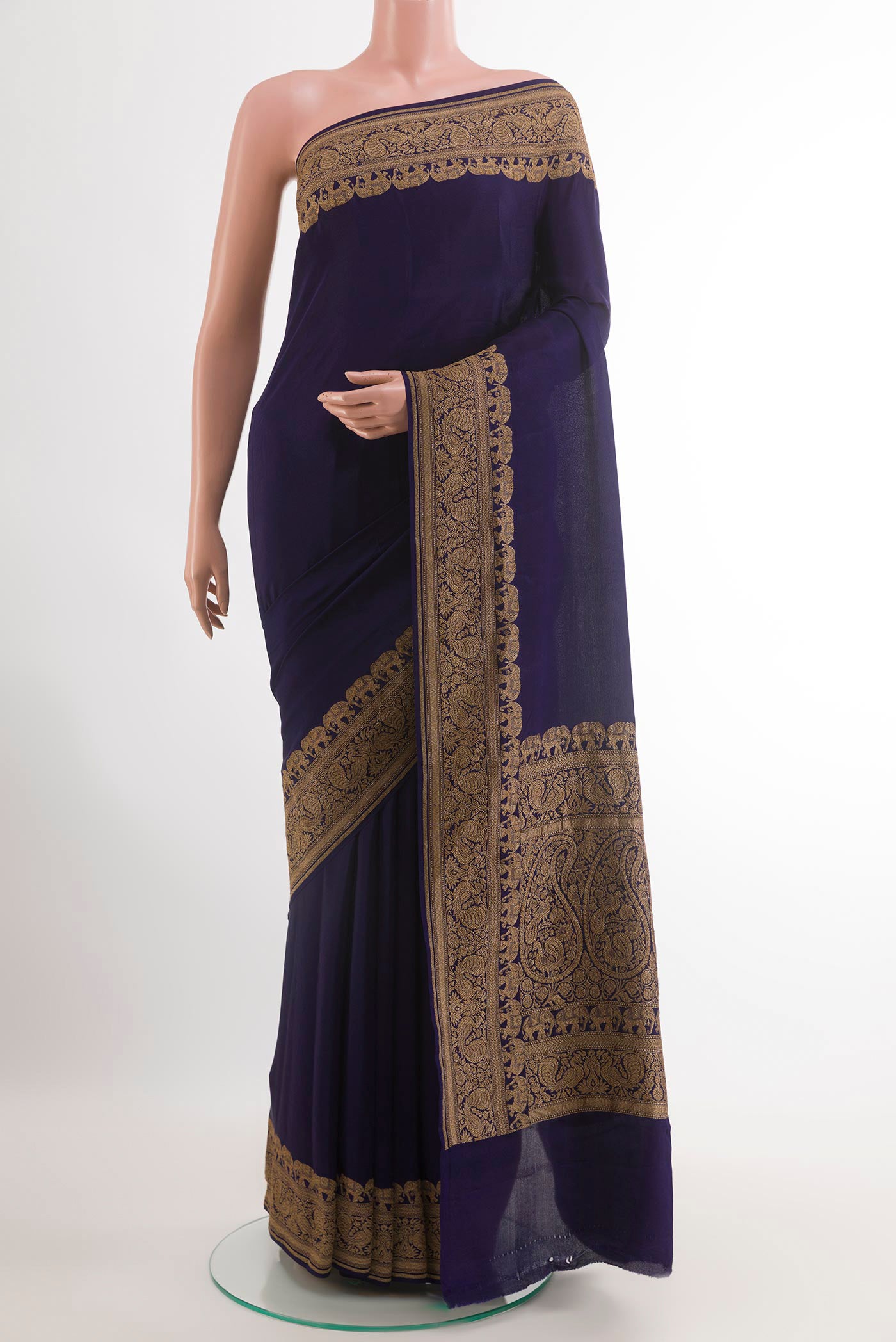 Blue Banarasi Georgette Saree with Plain Body and Zari Border.  displayed on a mannequin