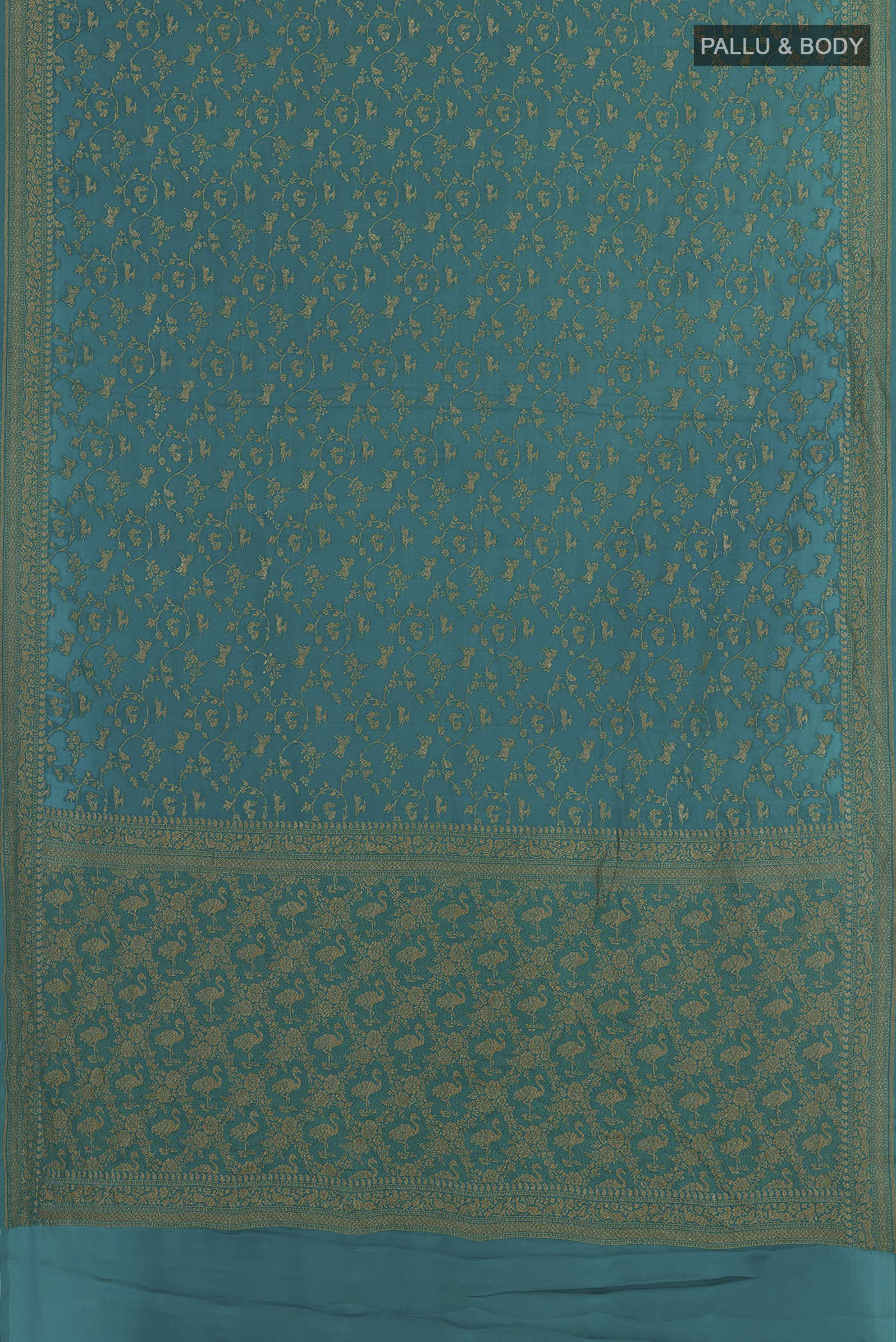 Flat view of Teal Banarasi Georgette Saree with Zari Brocade on the body and Zari Border. 