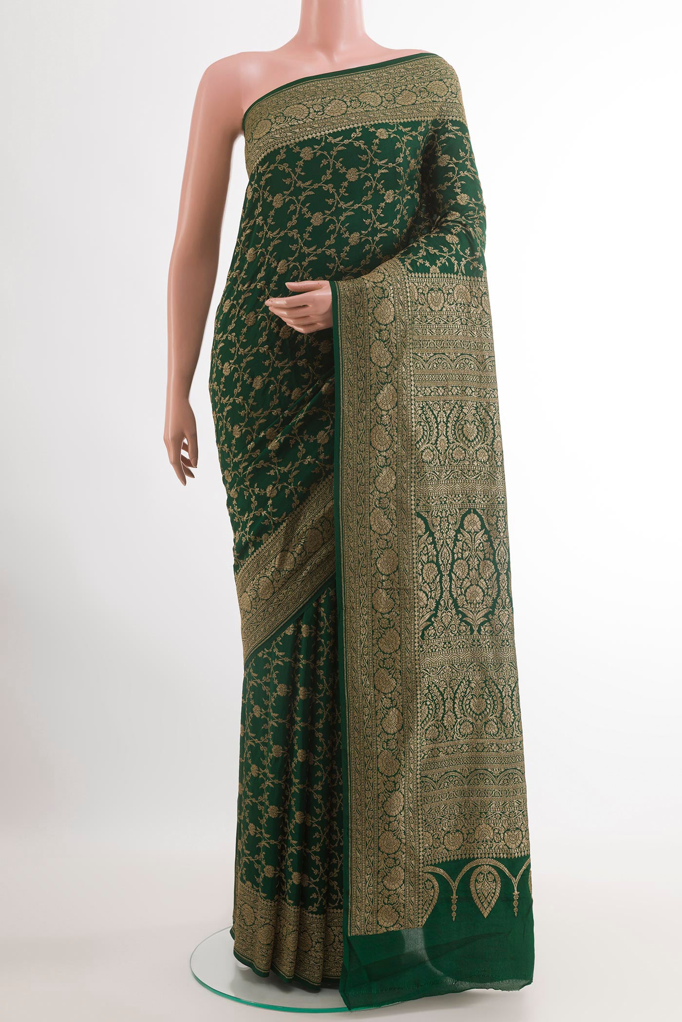 Green Banarasi Georgette Saree with Zari Brocade on the body and Zari Border.  displayed on a mannequin