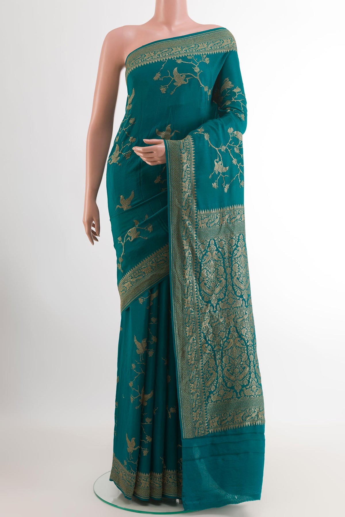 Sea Green Banarasi Georgette Saree with Zari Brocade on the body and Thread Border.  displayed on a mannequin
