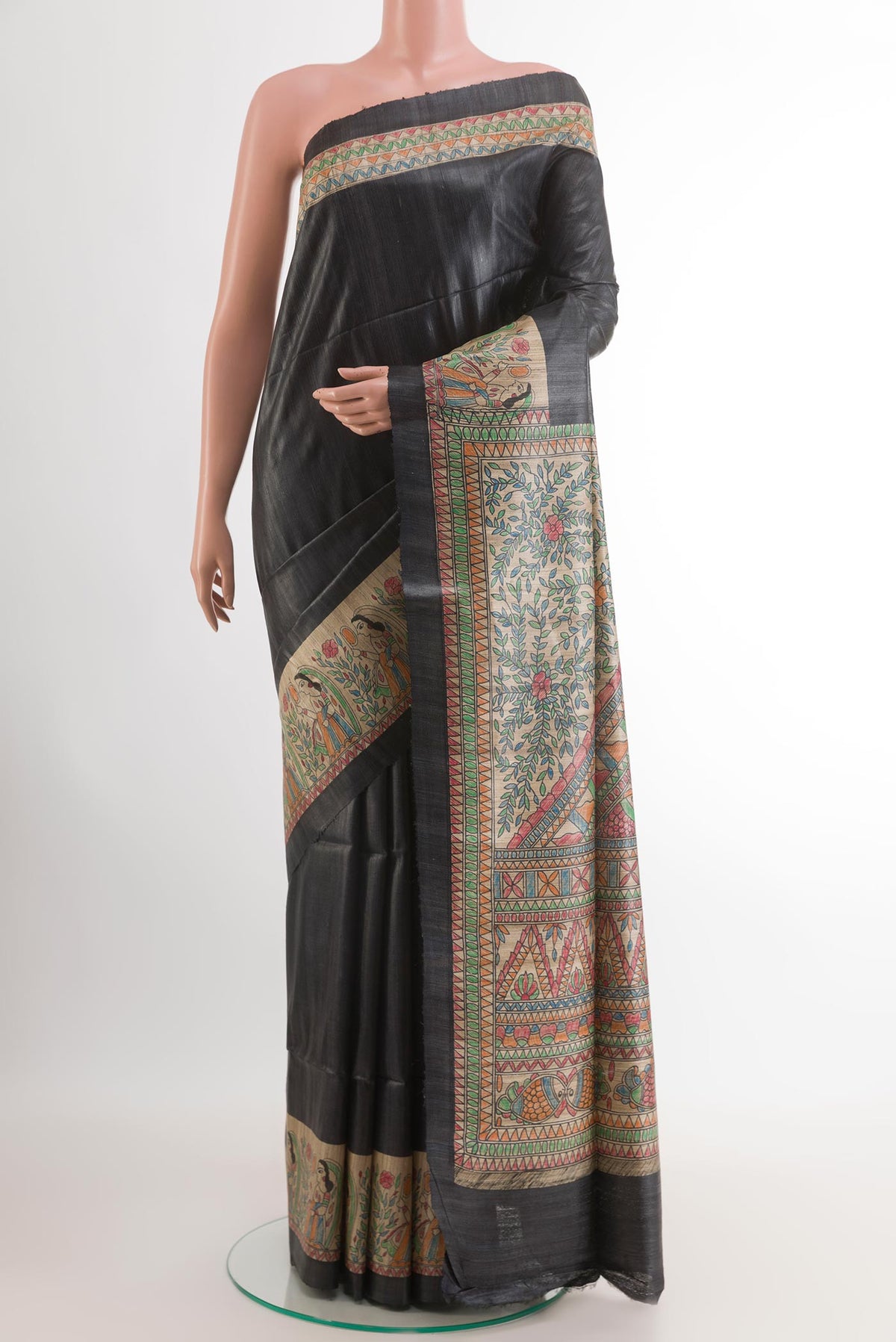Black Tussar Saree with Plain Body and Printed Border.  displayed on a mannequin
