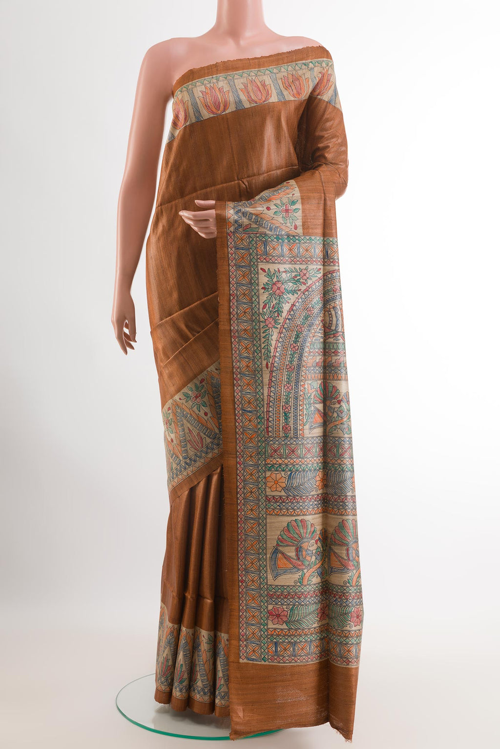Brown Tussar Saree with Plain Body and Printed Border.  displayed on a mannequin