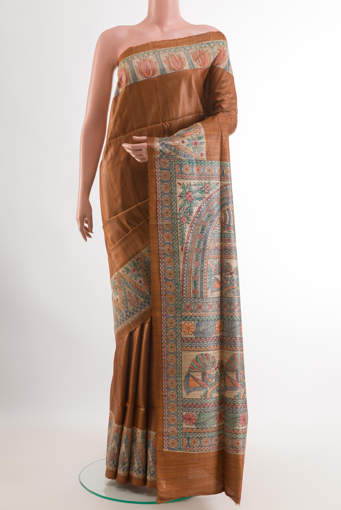 Brown Tussar Saree with Plain Body and Printed Border.  displayed on a mannequin