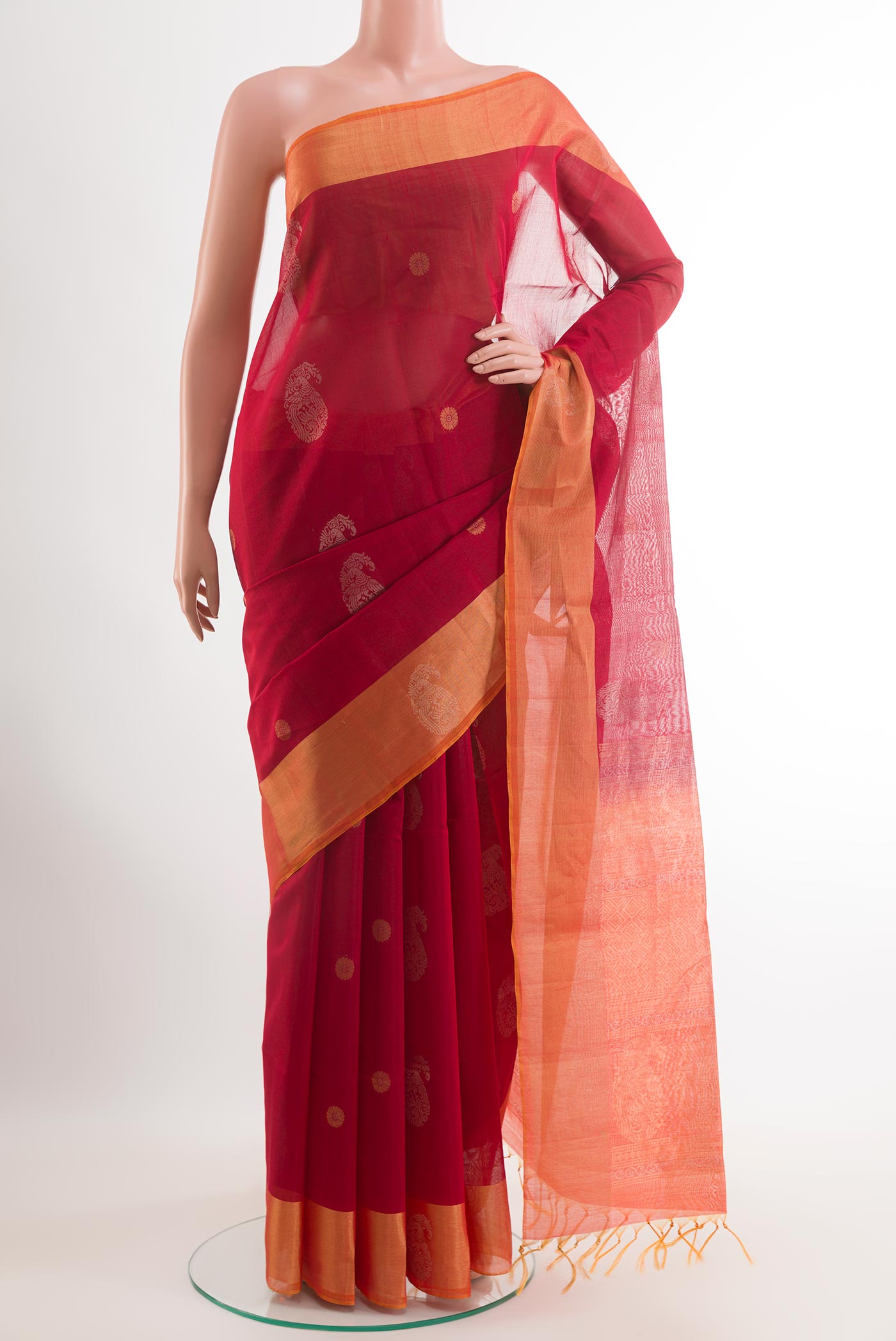 Red Blended Kora Cotton Saree with Zari Butta on the body and Zari Border.  displayed on a mannequin