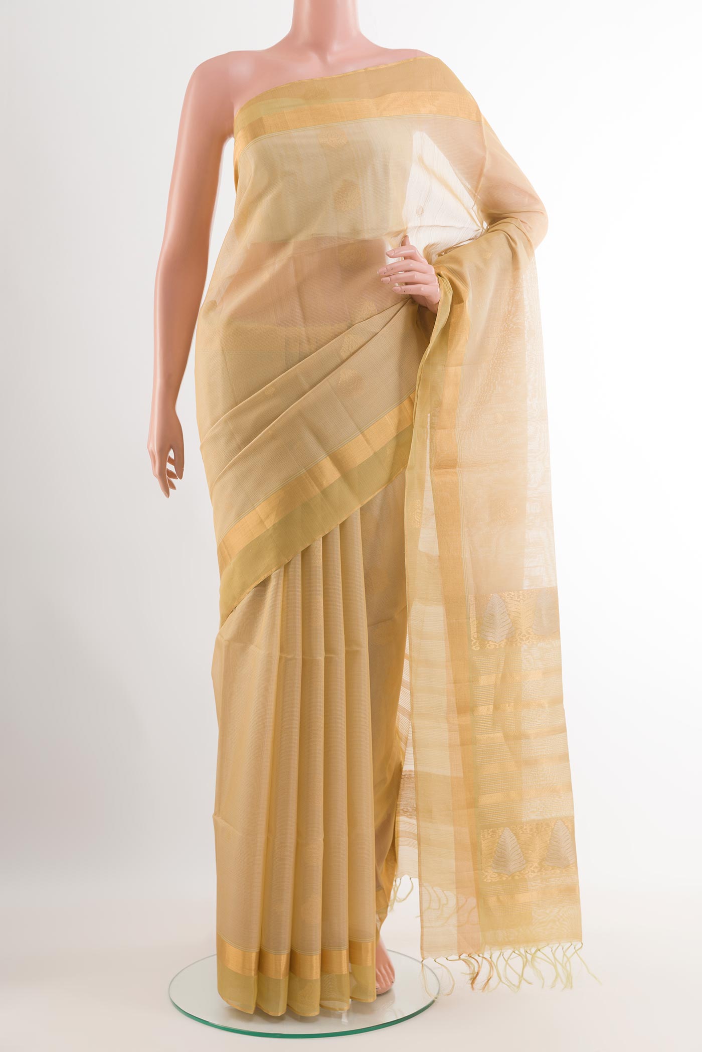 Beige Blended Kora Cotton Saree with Zari Butta on the body and Zari Border.  displayed on a mannequin