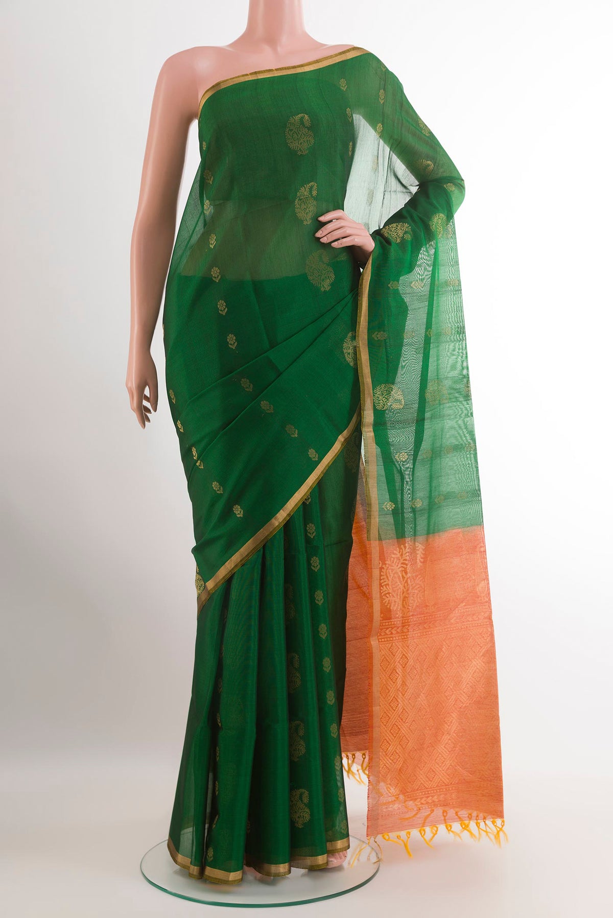 Green Blended Kora Cotton Saree with Zari Butta on the body and Zari Border.  displayed on a mannequin