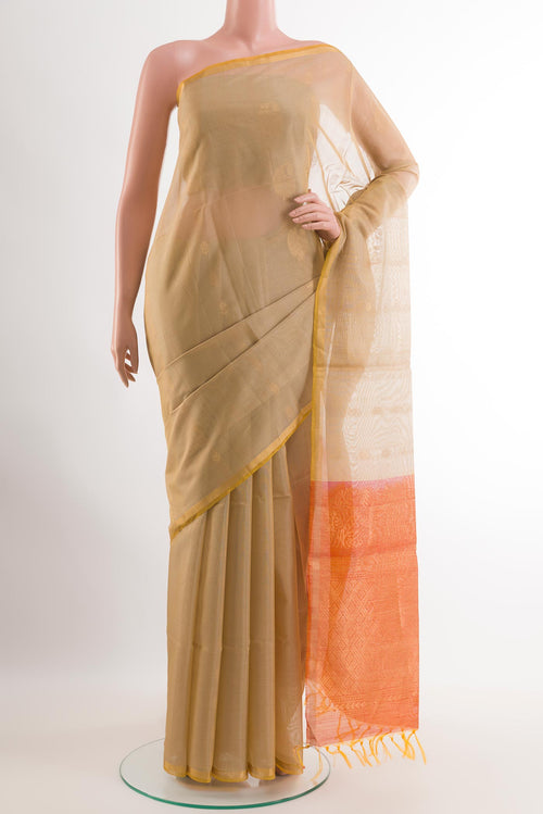 Beige Blended Kora Cotton Saree with Zari Butta on the body and Zari Border.  displayed on a mannequin