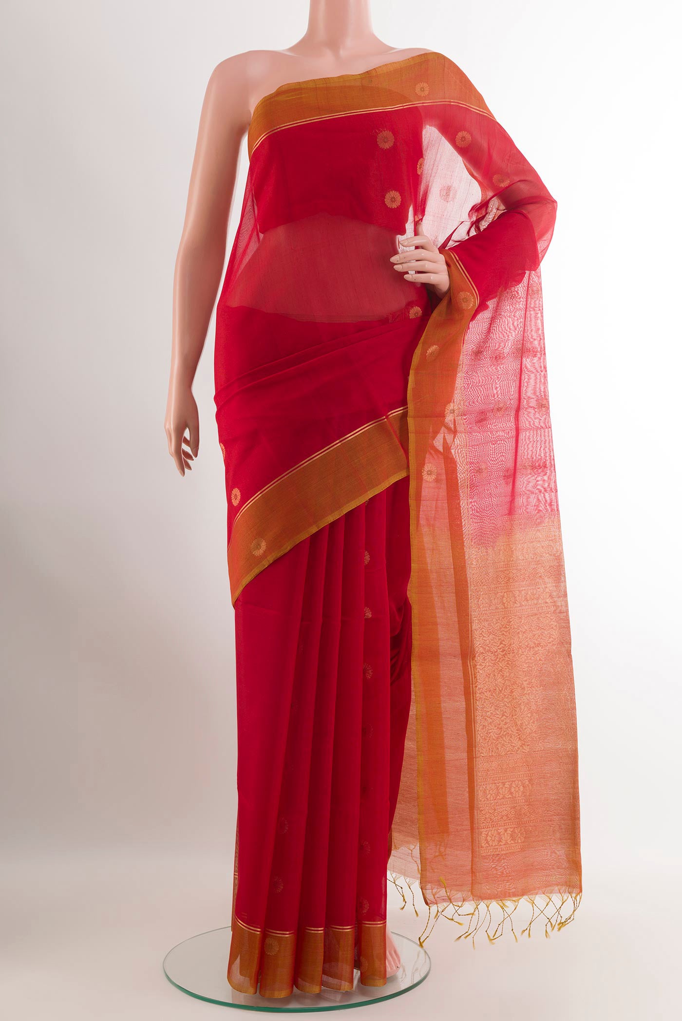 Red Blended Kora Cotton Saree with Zari Butta on the body and Zari Border.  displayed on a mannequin
