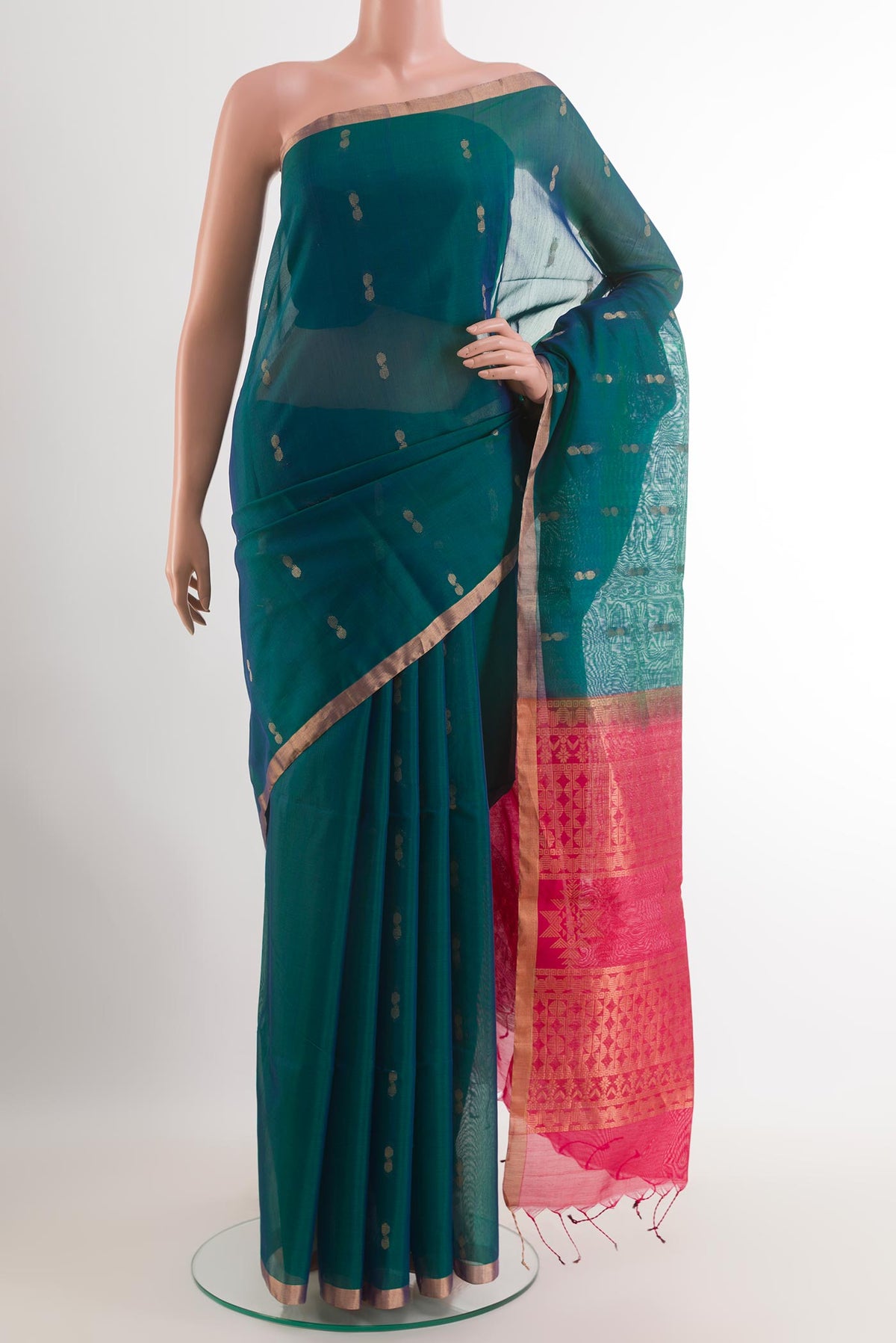Teal Blended Kora Cotton Saree with Zari Butta on the body and Zari Border.  displayed on a mannequin