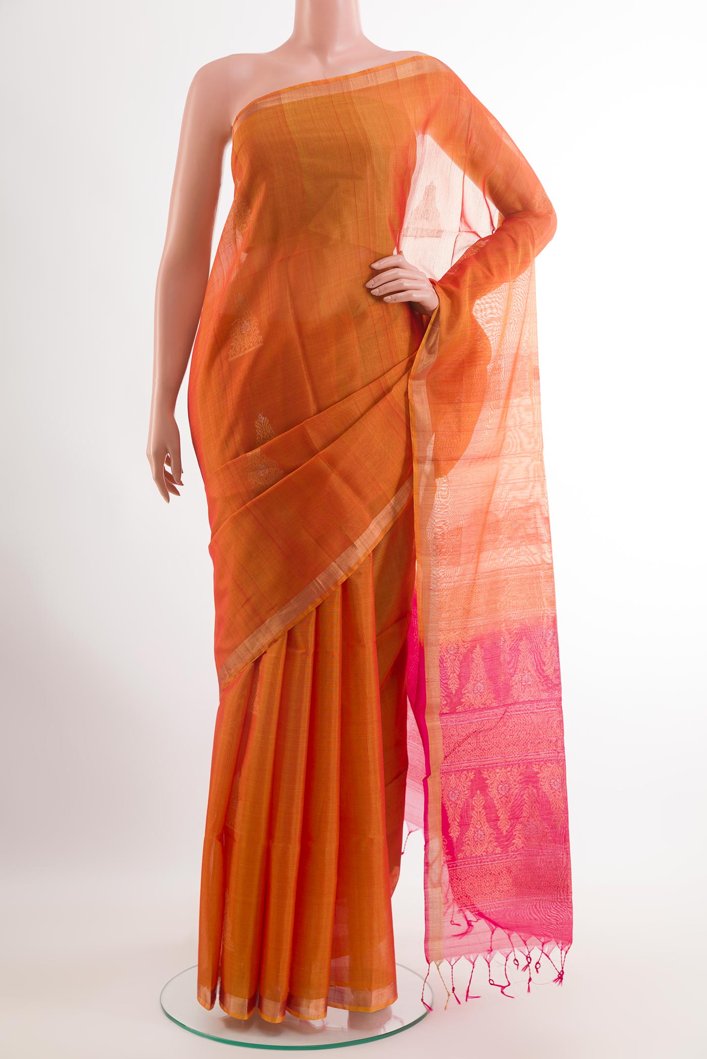 Orange Blended Kora Cotton Saree with Stripes on the body and Zari Border.  displayed on a mannequin