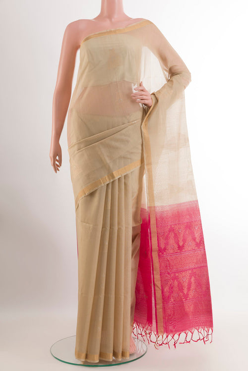 Beige Blended Kora Cotton Saree with Zari Butta on the body and Zari Border.  displayed on a mannequin