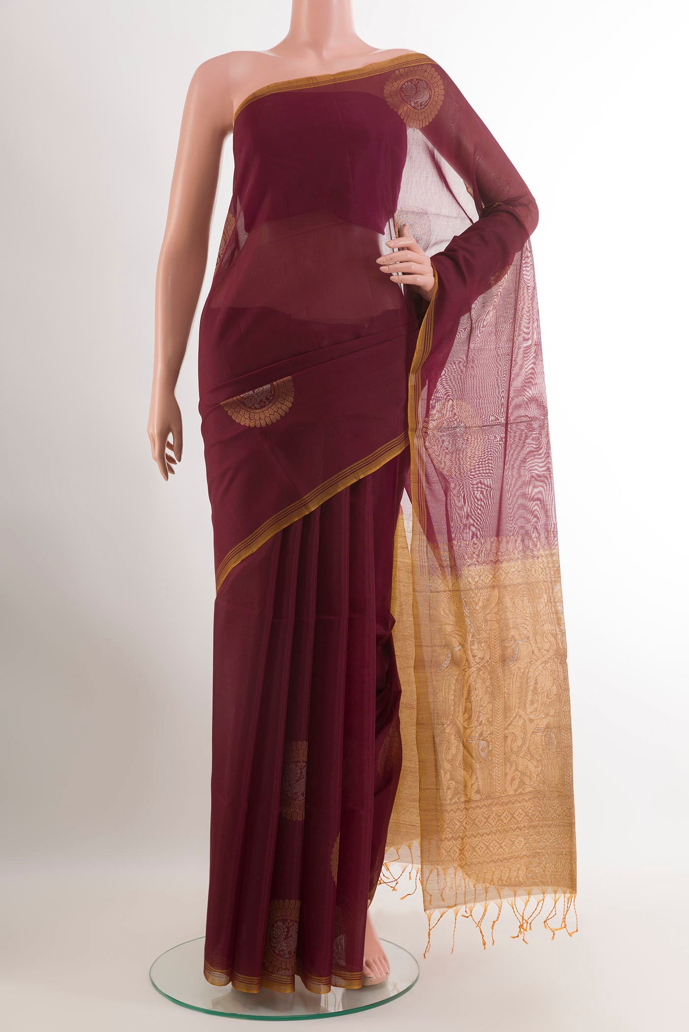 Brown Blended Kora Cotton Saree with Zari Butta on the body and Zari Border.  displayed on a mannequin
