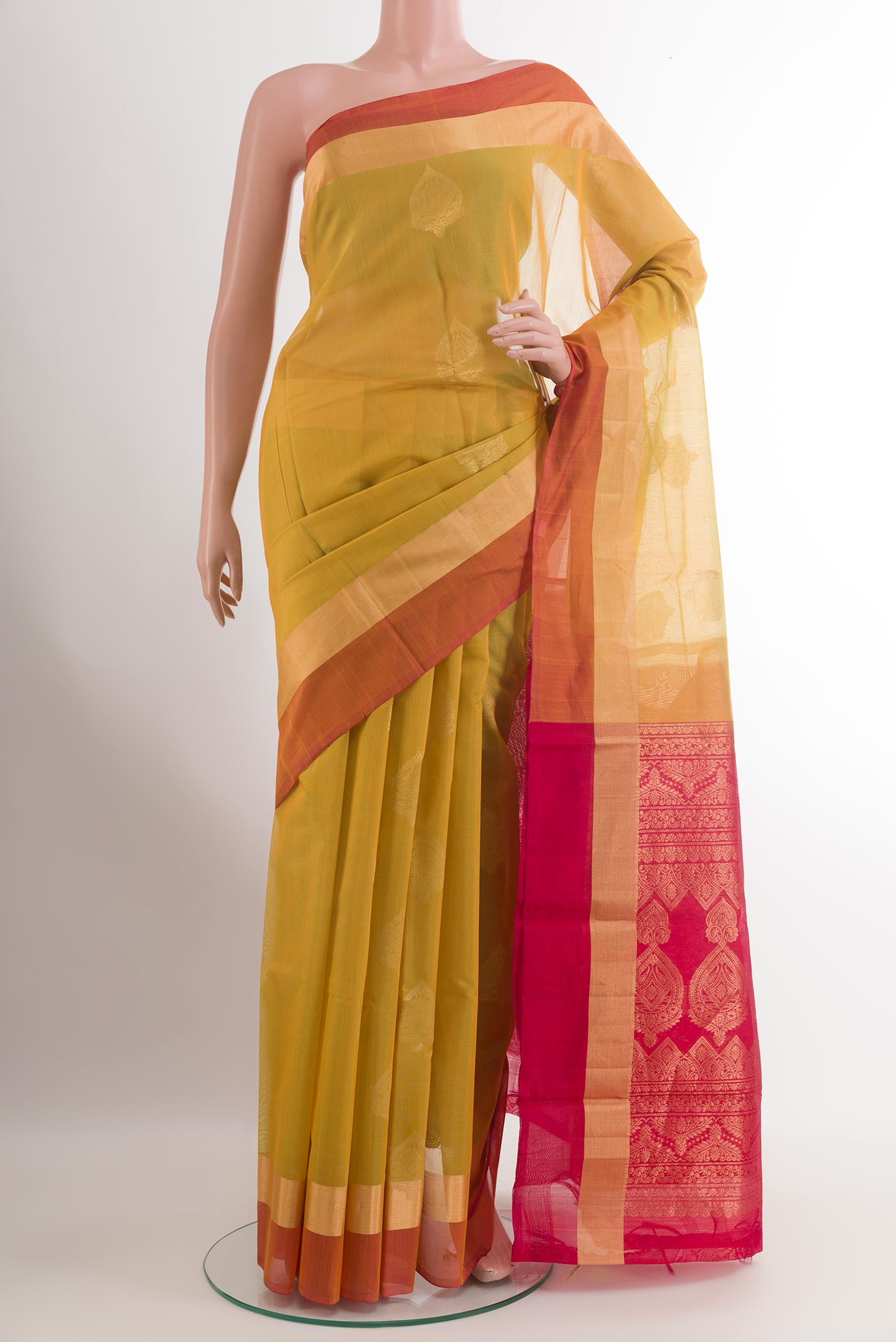 Lemon Yellow Blended Kora Cotton Saree with Zari Butta on the body and Zari Border.  displayed on a mannequin