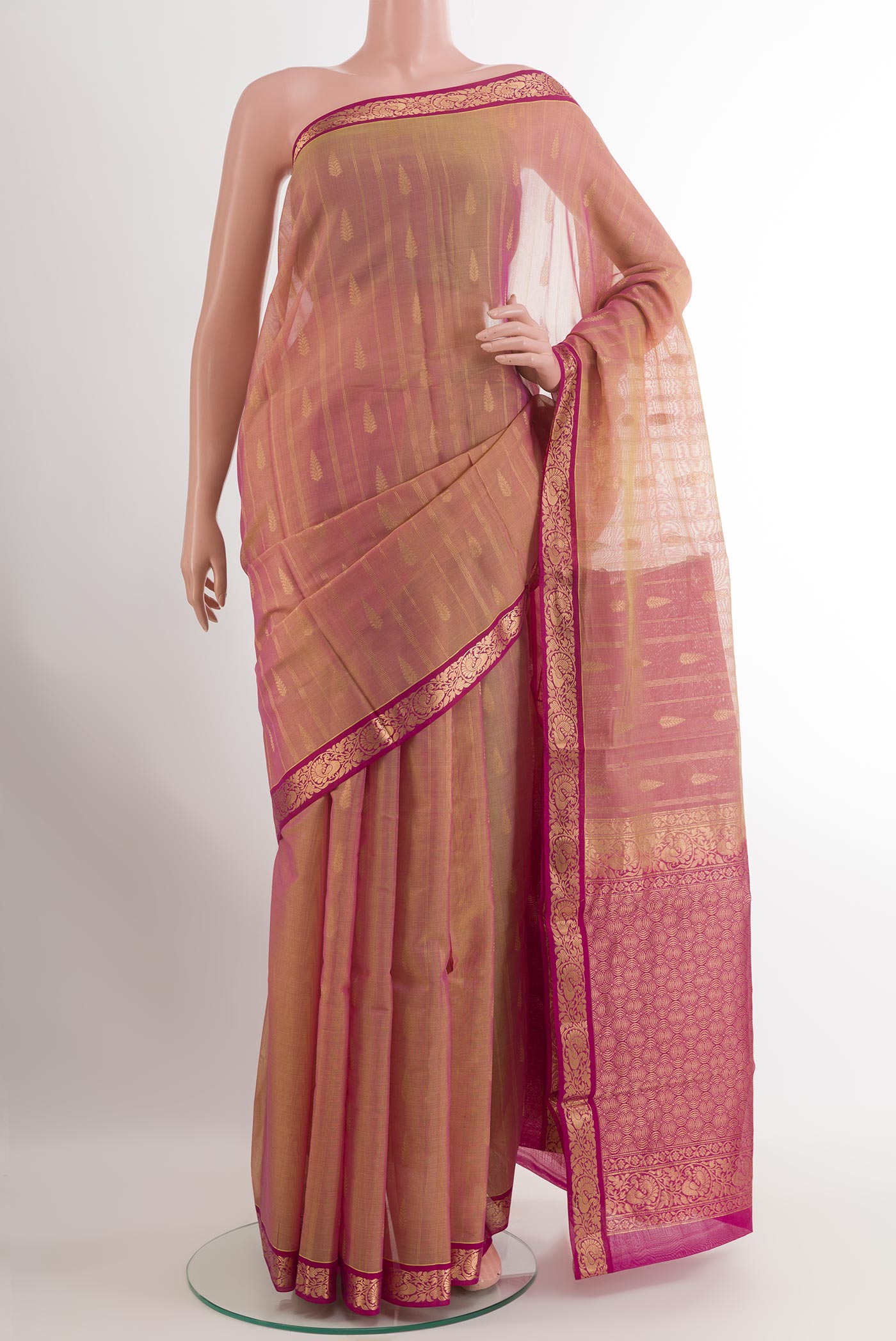 Beige Blended Kora Cotton Saree with Zari Butta on the body and Zari Border.  displayed on a mannequin