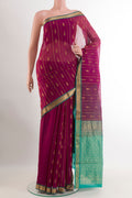 Purple Blended Kora Cotton Saree with Zari Butta on the body and Zari Border.  displayed on a mannequin