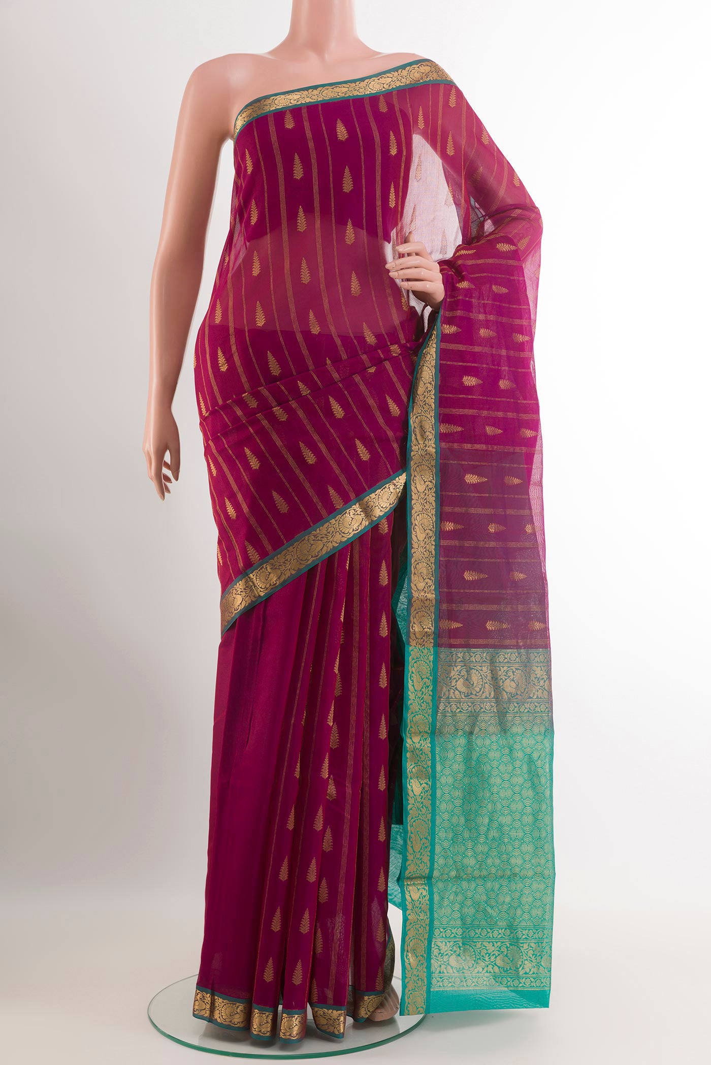 Purple Blended Kora Cotton Saree with Zari Butta on the body and Zari Border.  displayed on a mannequin