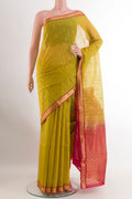 Light Green Blended Kora Cotton Saree with Zari Butta on the body and Zari Border.  displayed on a mannequin