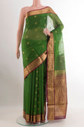 Green Blended Kora Cotton Saree with Zari Butta on the body and Zari Border.  displayed on a mannequin