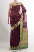 Purple Blended Kora Cotton Saree with Zari Butta on the body and Zari Border.  displayed on a mannequin