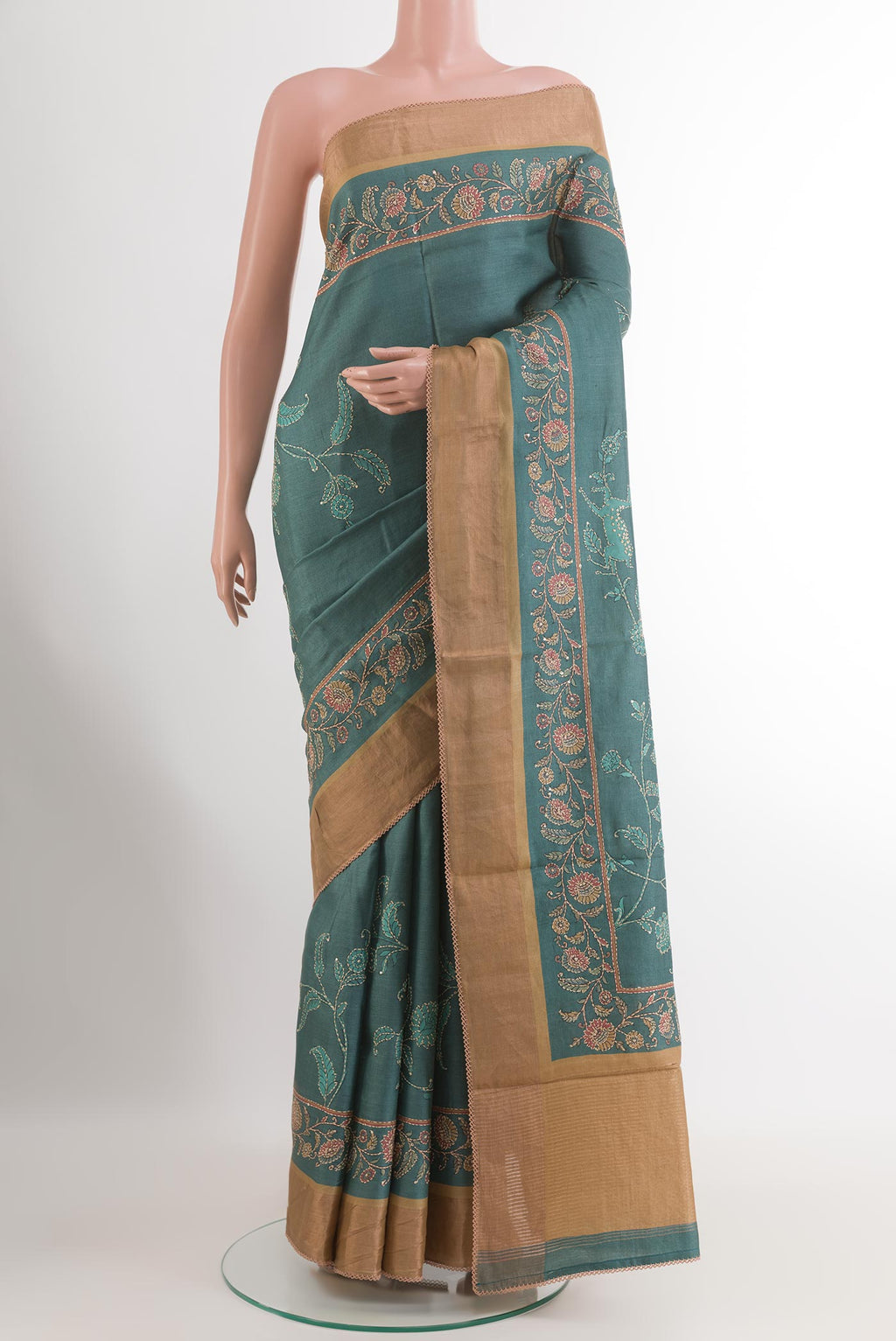 Blue Tussar Saree with Printed design on the body and Zari Border.  displayed on a mannequin