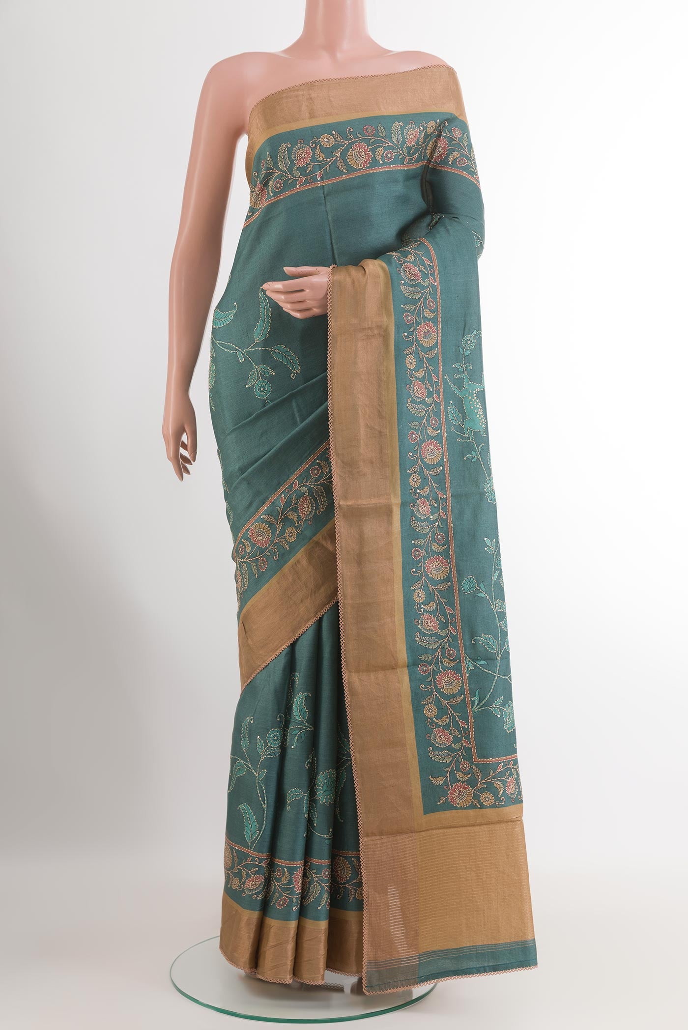 Blue Tussar Saree with Printed design on the body and Zari Border.  displayed on a mannequin