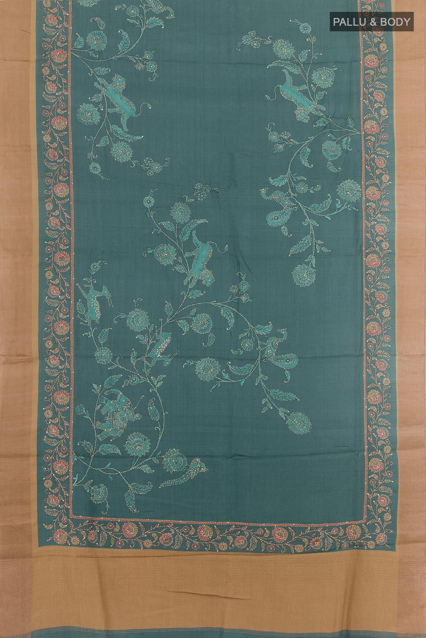 Flat view of Blue Tussar Saree with Printed design on the body and Zari Border. 