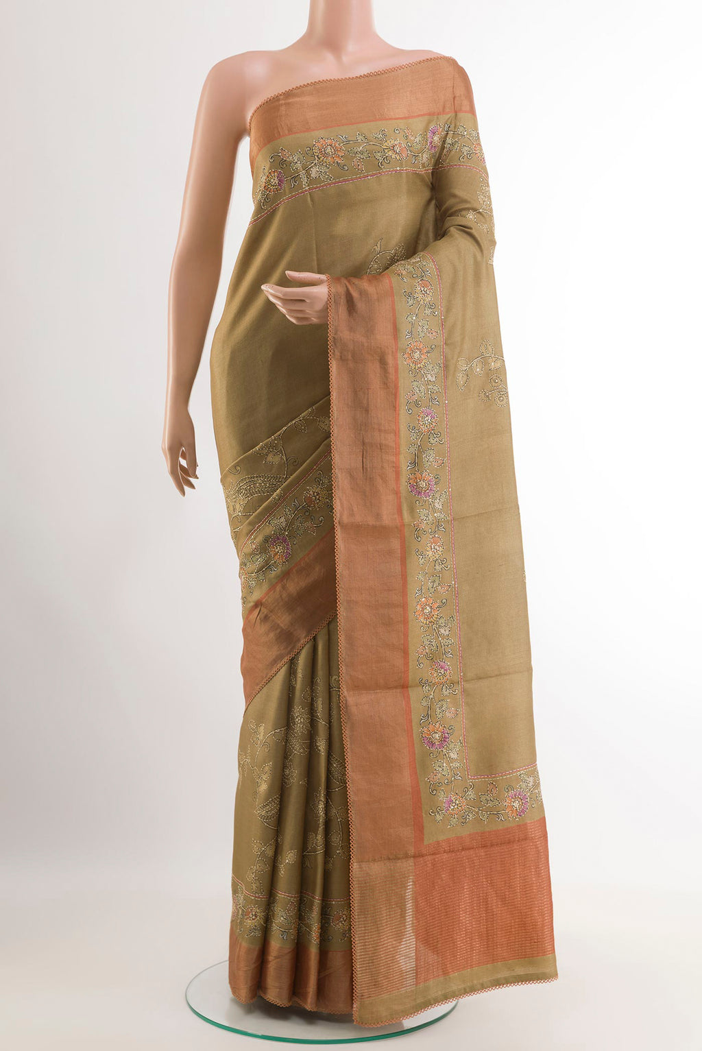 Beige Tussar Saree with Embroidery on the body and Zari Border.  displayed on a mannequin