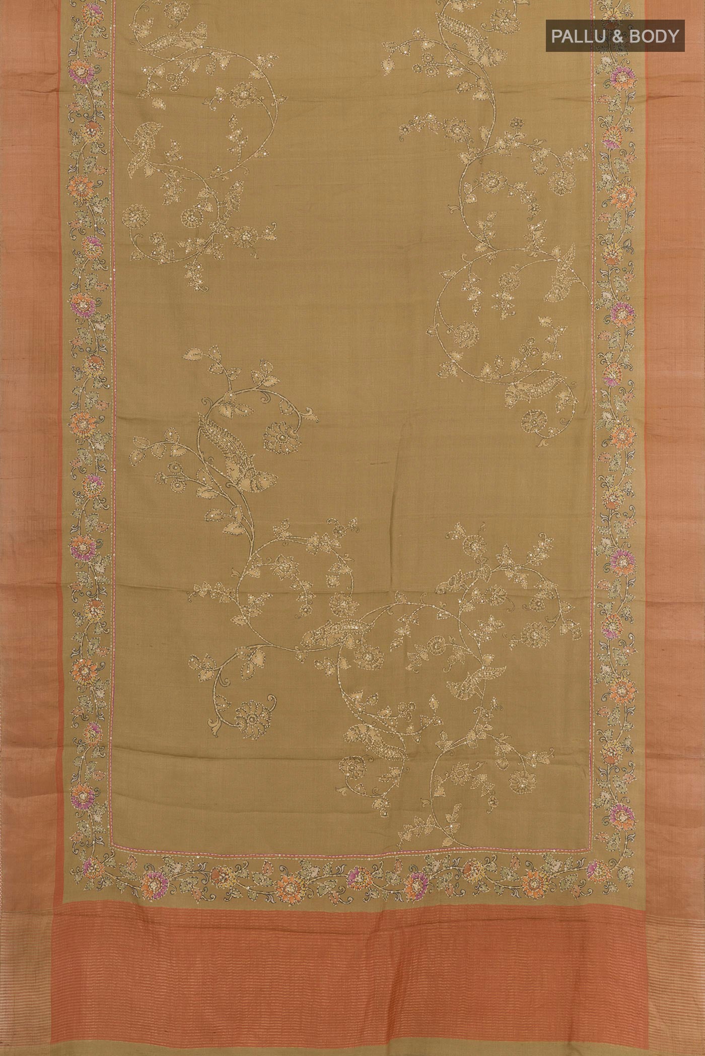 Flat view of Beige Tussar Saree with Embroidery on the body and Zari Border. 