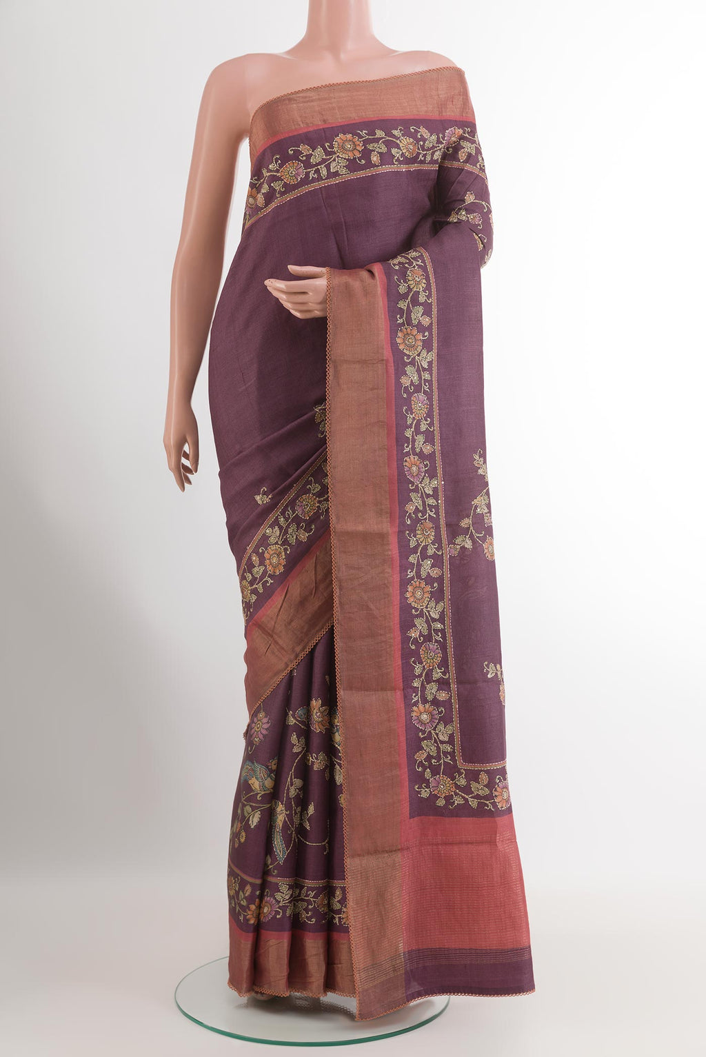 Purple Tussar Saree with Printed design on the body and Zari Border.  displayed on a mannequin