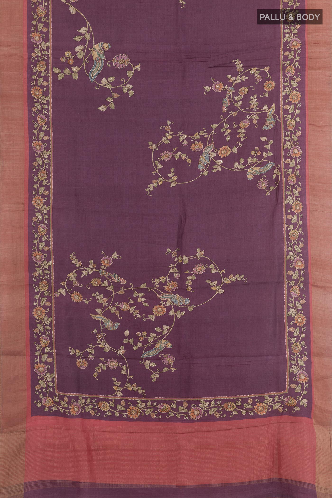 Flat view of Purple Tussar Saree with Printed design on the body and Zari Border. 