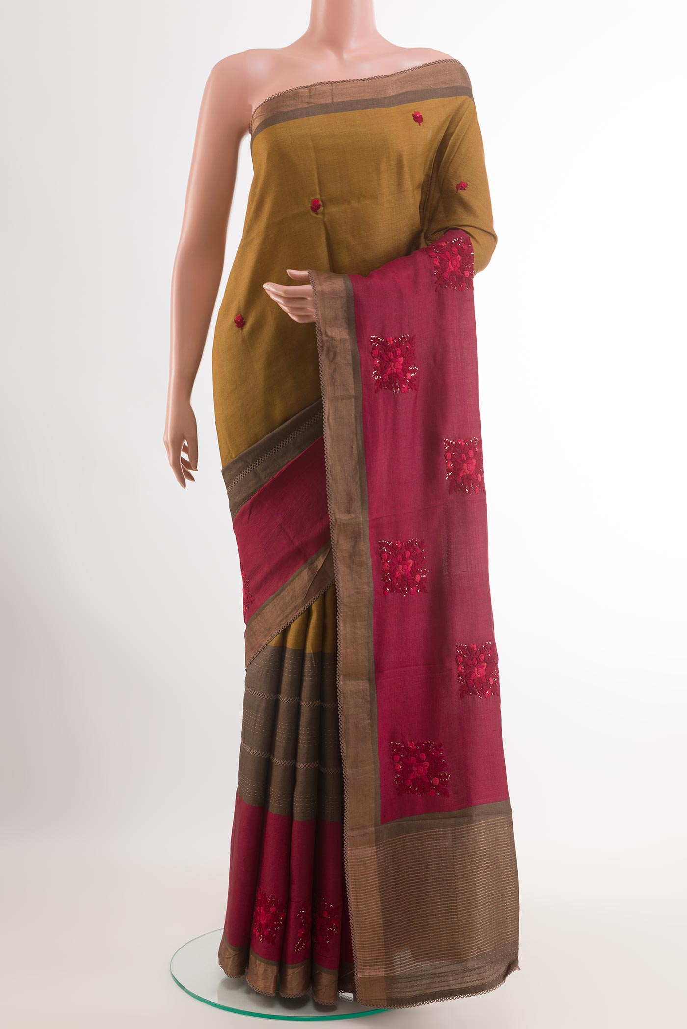 Multi Color Tussar Saree with Embroidery on the body and Zari Border.  displayed on a mannequin